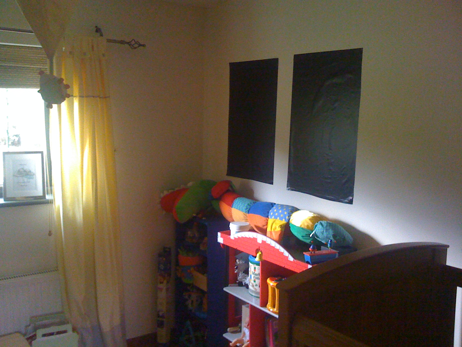 Magic Blackout Blind stuck to a wall in nursery when not in use on window